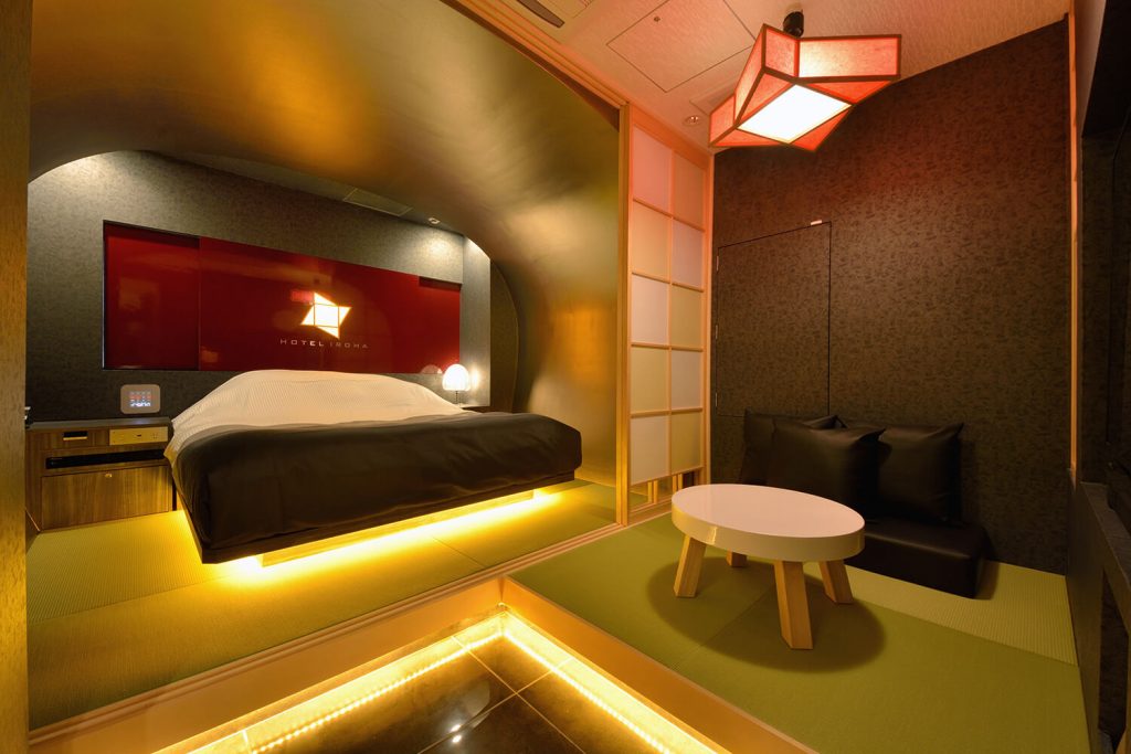A modern love hotel room with tatami floors