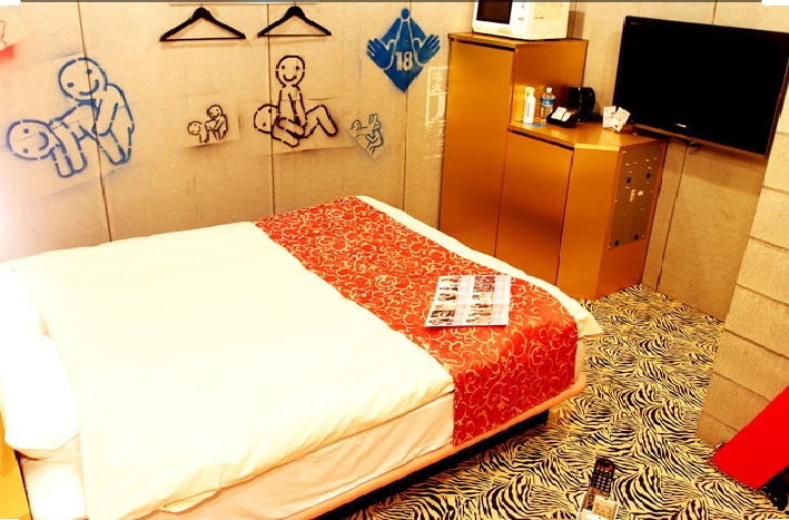 Hotel Rochelle in Tokyo with painting on the wall.