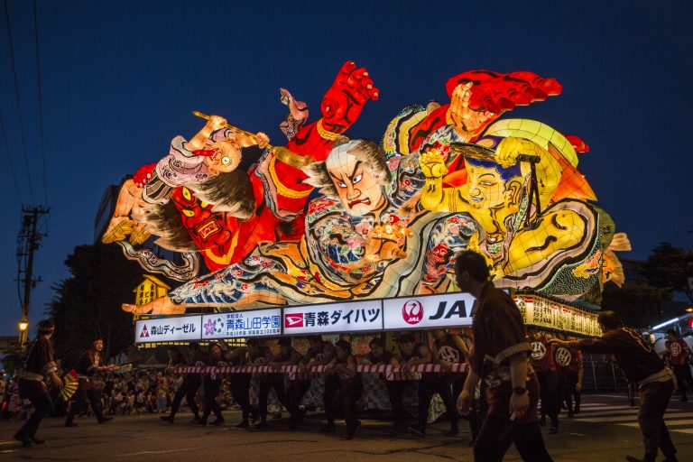 Top 10 Unique Japanese Festivals a floater being lifted during the Nebuta festival.
