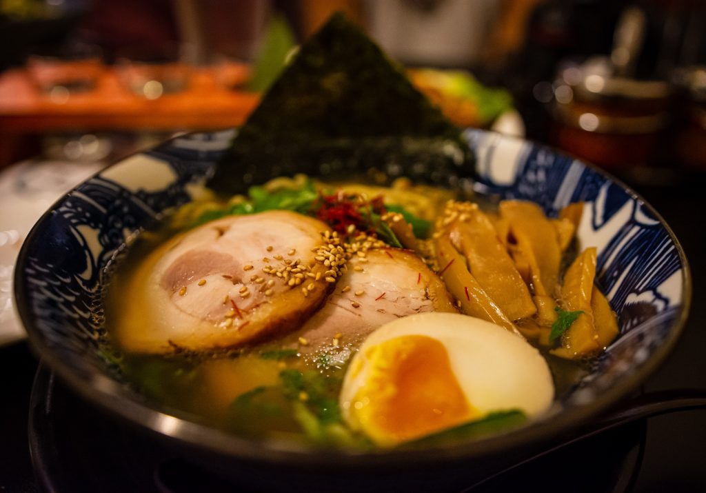 Ramen with egg and slice of meat.