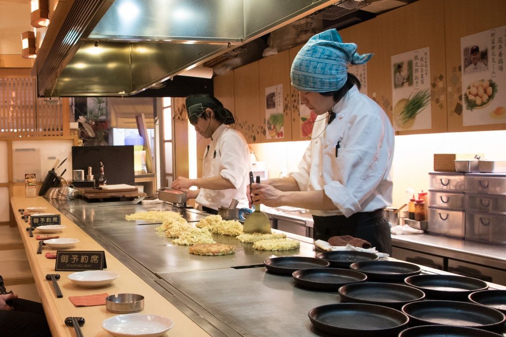 Chefs making Okonomiyaki. 