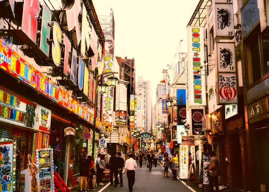 Colorful Tokyo high street with stores.