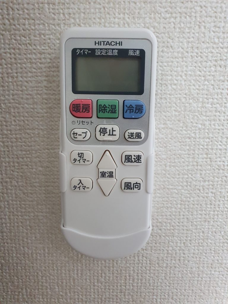 A Japanese air conditioner remote controller.