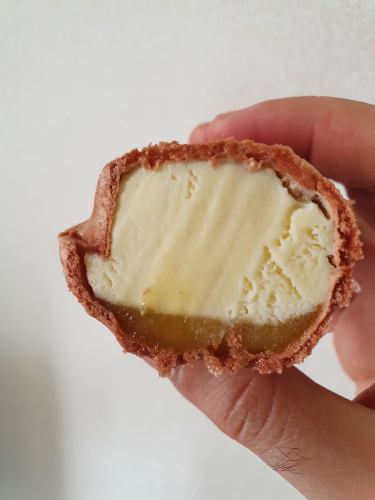 A sweet potato shaped ice cream cut in half revealing the interior. One of the unique Japanese ice creams