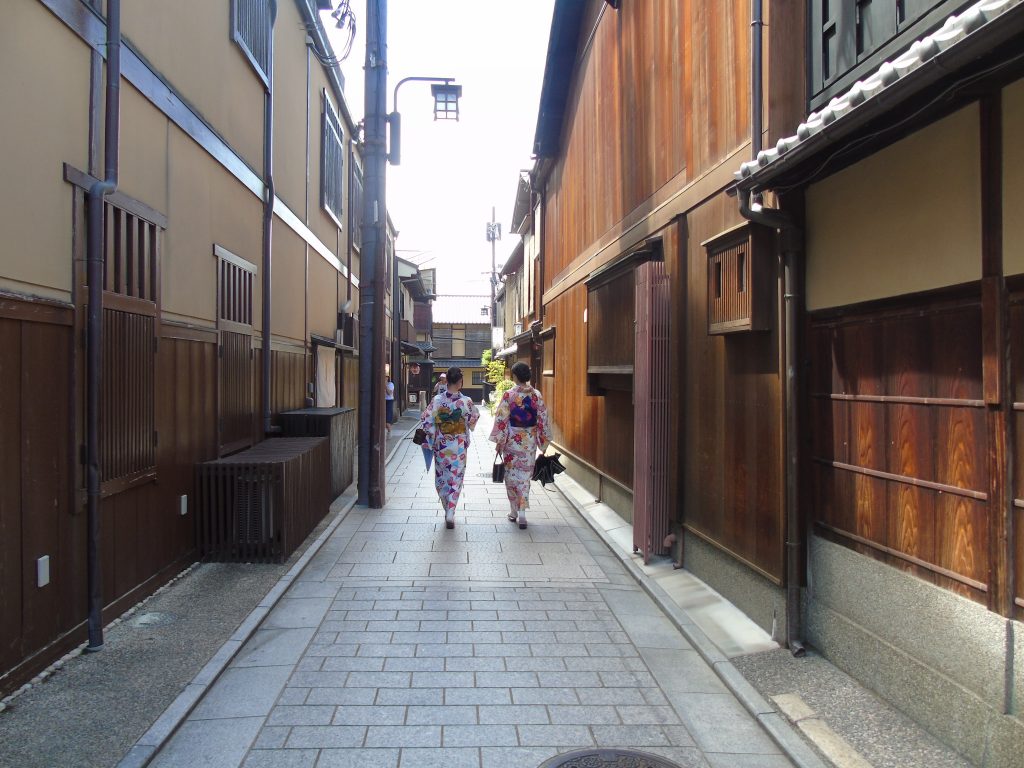 What are the top places to go to or sights to see in Kyoto?
Two girls in colorful Yukatas walking through the Gion District in Kyoto