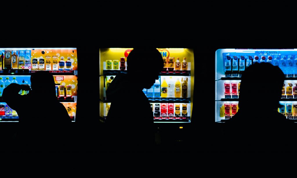 Pedestrians walking past vending machines in Japan. The Strange and Amazing Vending Machines of Japan 