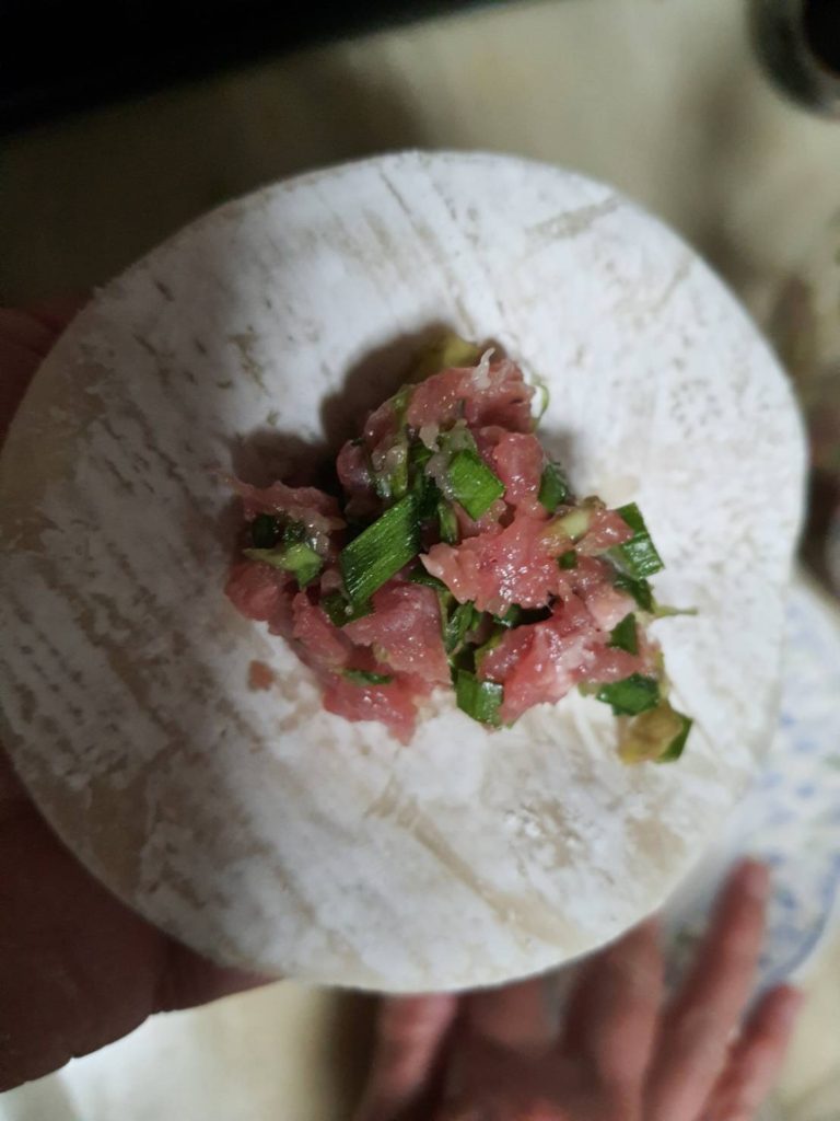 Nira and Minced Pork on a wrapping sheet 
