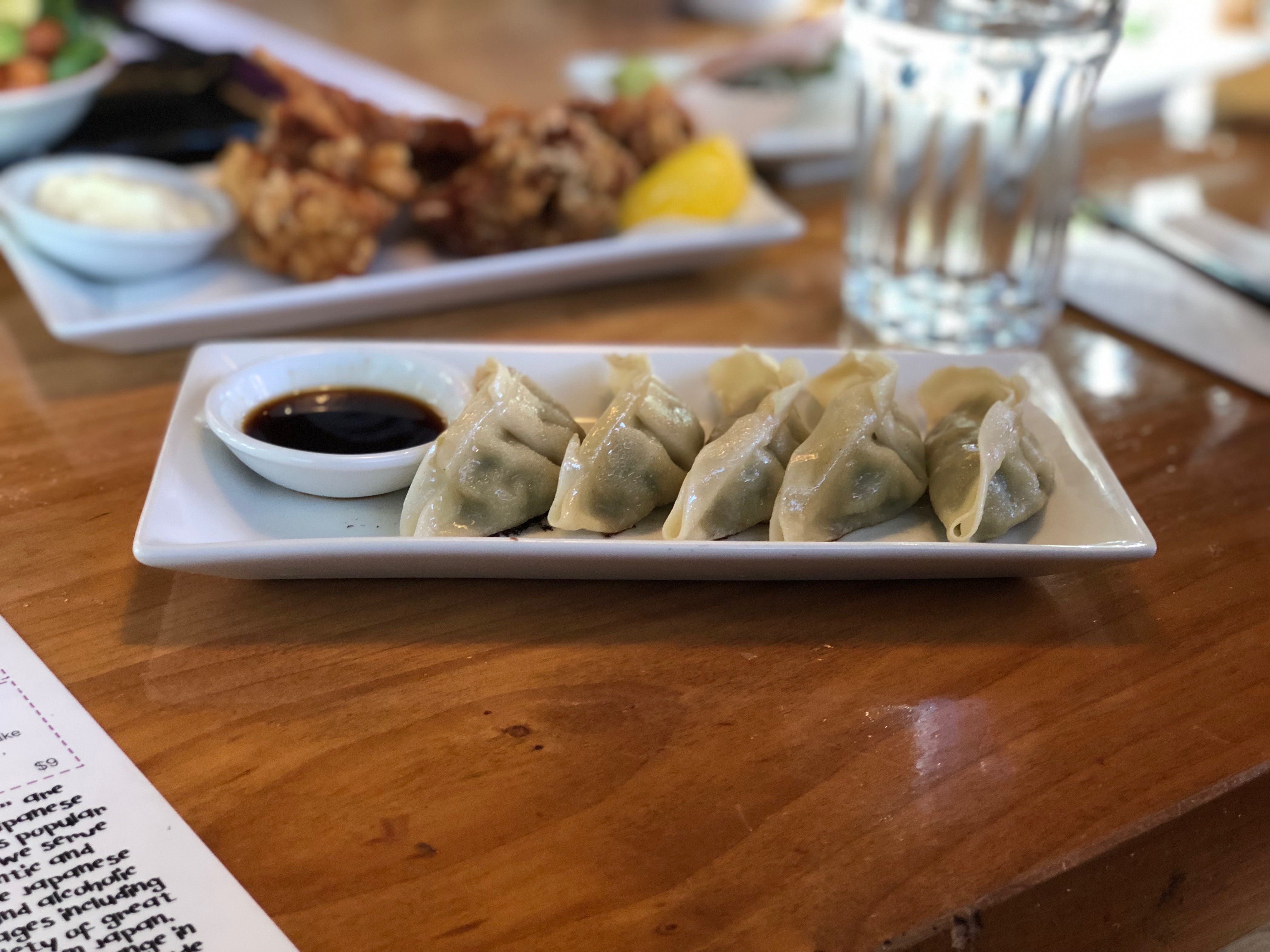 A plate of Gyoza served with Soy Sauce Dipping Sauce
