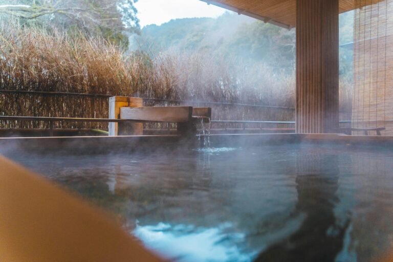 Japanese outdoor hot spring with mountain scenery